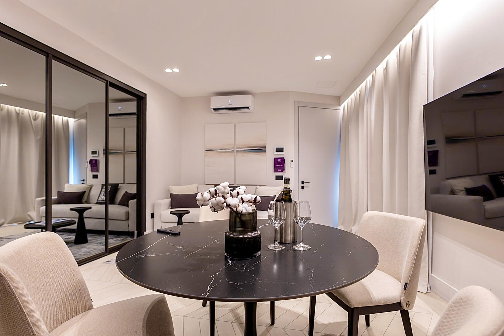 Spacious dining space for four with designer touches.